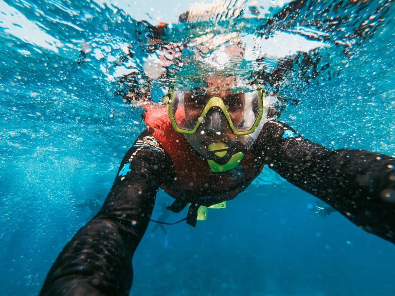 guy snorkeling on the surface