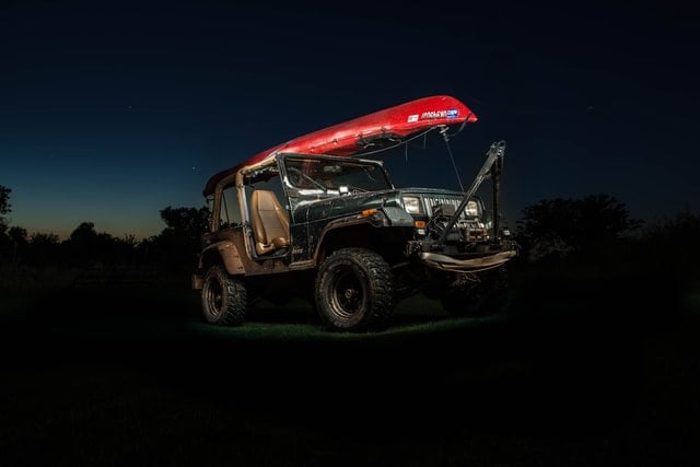 kayak on a jeep in the dark